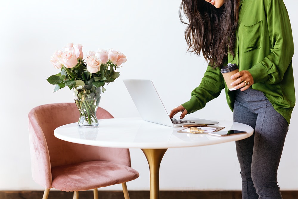 Woman look at computer on desk