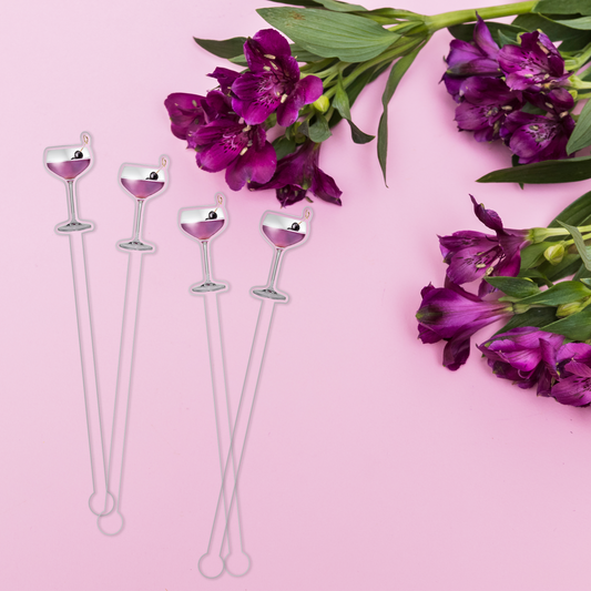 Aviation swizzle stick set in styled cocktail drink on home bar or entertaining setup.