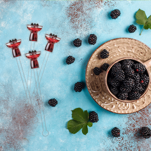 Blackberry Margarita swizzle stick set in styled cocktail drink on home bar or entertaining setup.