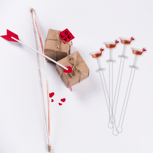Cupid's Arrow swizzle stick set in styled cocktail drink on home bar or entertaining setup.