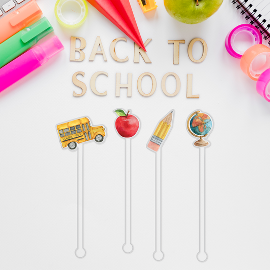I Drink Because I Teach swizzle stick set styled for a graduation celebration