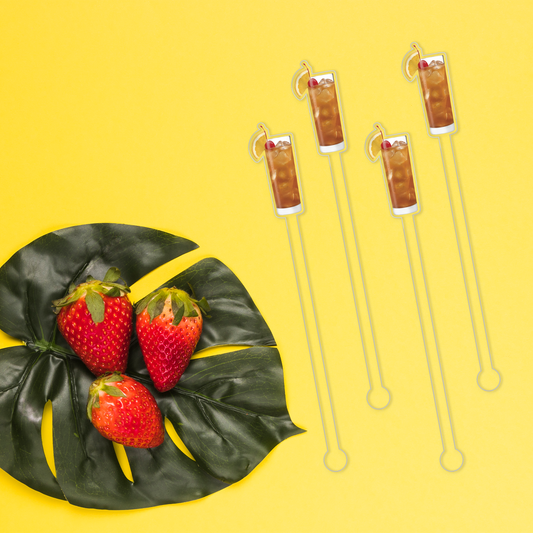 Rum Breeze swizzle stick set in styled cocktail drink on home bar or entertaining setup.